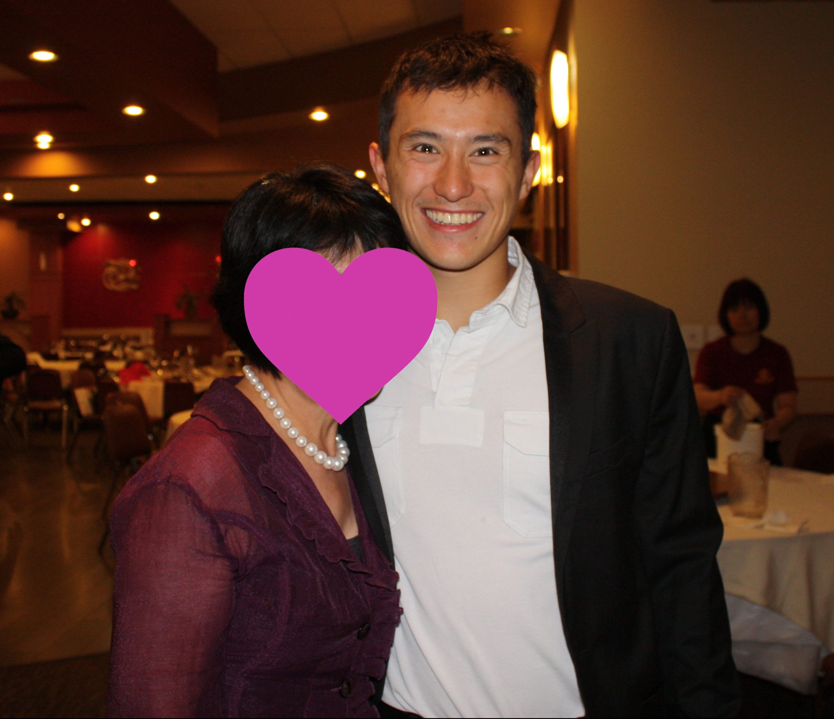Patrick Chan fan Happylife hugs and poses with a happy Patrick at a restaurant, May 2012. (Photo © Happylife. Used with permission.)