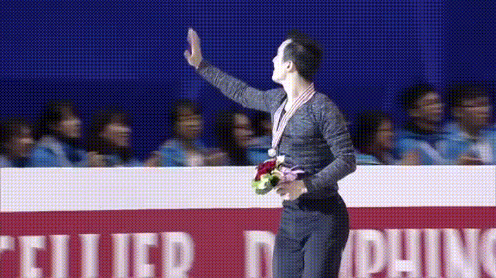 GIF of Patrick Chan waving and giving a thumbs up to fans during his victory lap at the 2016 Four Continents Championships in Taipei, Taiwan. Source: YouTube