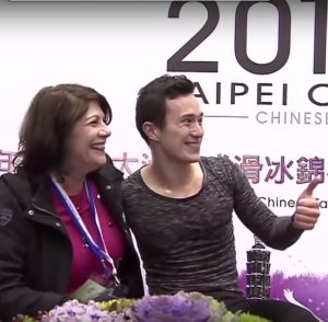 Patrick Chan and coach Kathy Johnson wave to the crowd after his victory at the 2016 Four Continents Championship in Taipei, February 2016