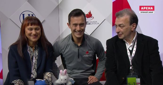 Patrick Chan smiling with his coaches after his short program, October 28, 2016.