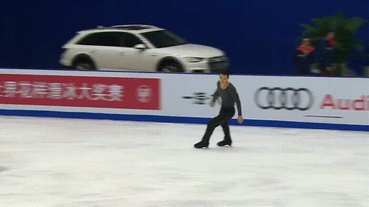 Patrick Chan picks up something off the ice before his free skate at Cup of China, November 19, 2016