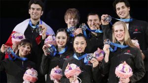 Canadian Figure Skating team members, front row from left, Meagan Duhamel, Kaetlyn Osmond, Cabrielle Daleman, Kaitlyn Weaver, rear row from left, Eric Radford, Kevin Reynolds, Patrick Chan, and Andrew Pole, pose with their silver medals for photographer during an award ceremony of the ISU World Team Trophy in Figure Skating in Tokyo, Saturday, April 13, 2013. (AP Photo / Koji Sasahara / Source: Sportsnet.ca)